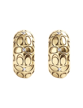 Aretes huggies Coach con acabado brillante